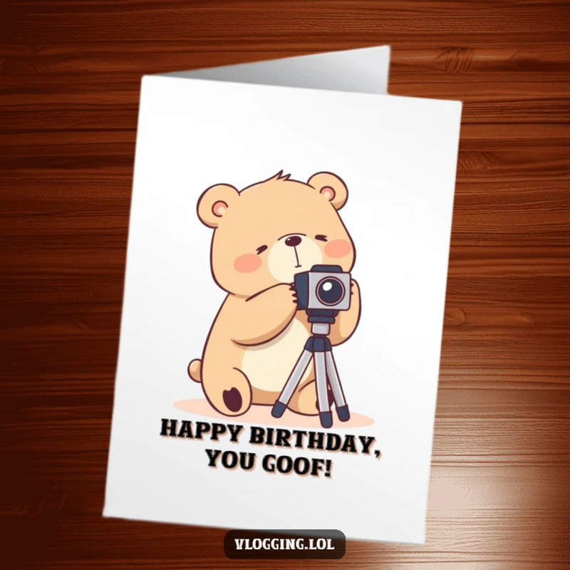 Funny Free Printable Birthday Card: A silly bear struggling to set up a camera tripod, awkward photography humor.