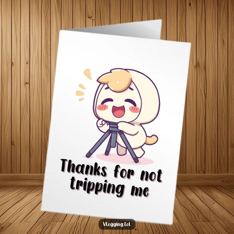 Funny Free Printable Thank You Card: Giggling character trips over a tripod with a yelp, symbolizing a funny, clumsy thank you.
